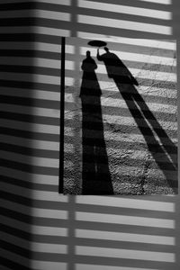 Shadow of person standing on floor