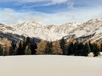 Scenic view of snowcapped mountains against sky