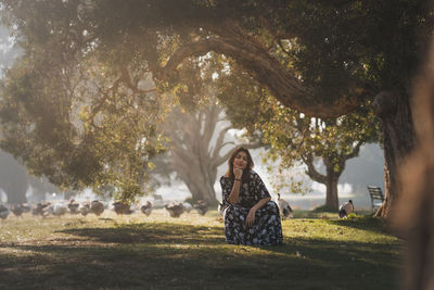 Woman sitting in park