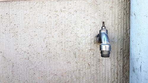 Close-up of water pipe on wall
