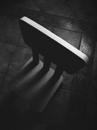 Close-up of shadow on tiled floor