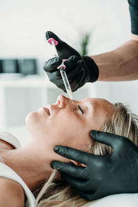 Young woman gets beauty facial injections in salon or clinic. skincare concept