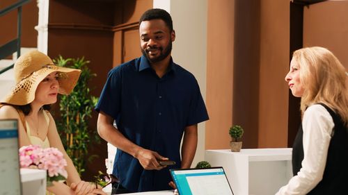 Side view of man using laptop at home