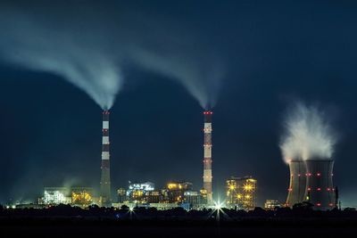 Illuminated power station at night