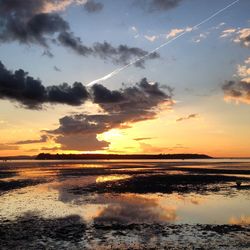 Scenic view of sea at sunset