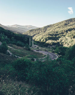 Road amidst mountains against sky