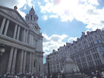 Low angle view of building against cloudy sky