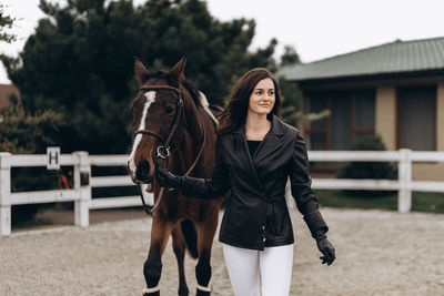 Side view of horse standing on field