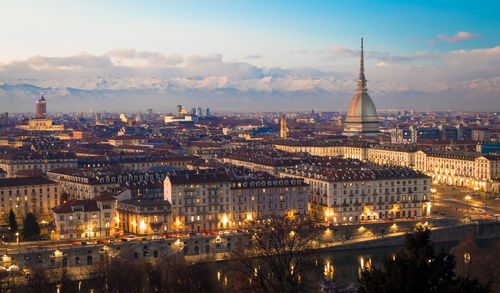 Aerial view of illuminated buildings in city