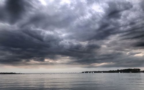 Scenic view of sea against cloudy sky