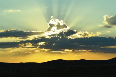 Scenic view of landscape against sky during sunset