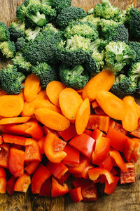 Mixed vegetables sliced on a cutting board still life