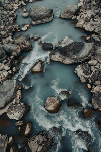 High angle view of rocks in river