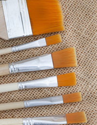 High angle view of various paintbrushes  on table
