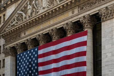 Low angle view of flag against building