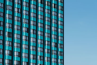 Turquoise skyscraper building windows texture