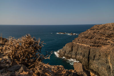 Scenic view of sea against clear sky