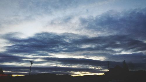 Scenic view of landscape against cloudy sky