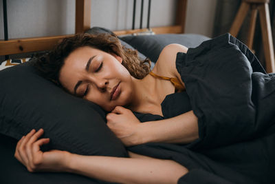 Serene sleeping woman sleeping in an orthopedic bed