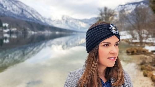 Smiling woman wearing headband in winter