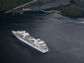 High angle view of airplane flying over sea