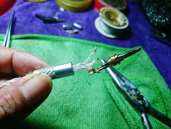 Close-up of hand holding cigarette