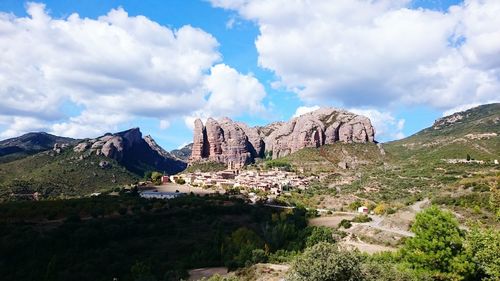 Scenic view of mountains against cloudy sky