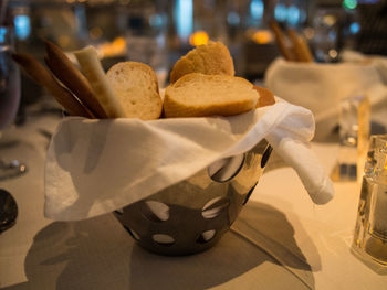 Close-up of breads in bowl on table