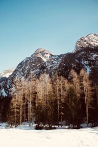 Scenic view of snowcapped mountains against clear sky
