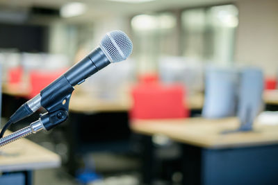 Close-up of microphone in hall