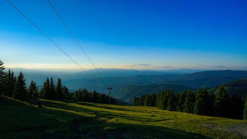 Scenic view of landscape against clear blue sky