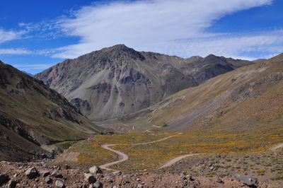 Scenic view of mountains against cloudy sky