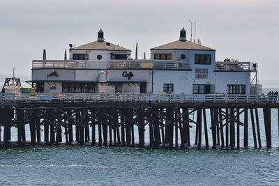 View of city by sea against clear sky