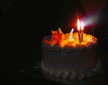 Close-up of illuminated tea light candles