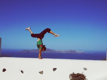 Full length of woman jumping in mid-air