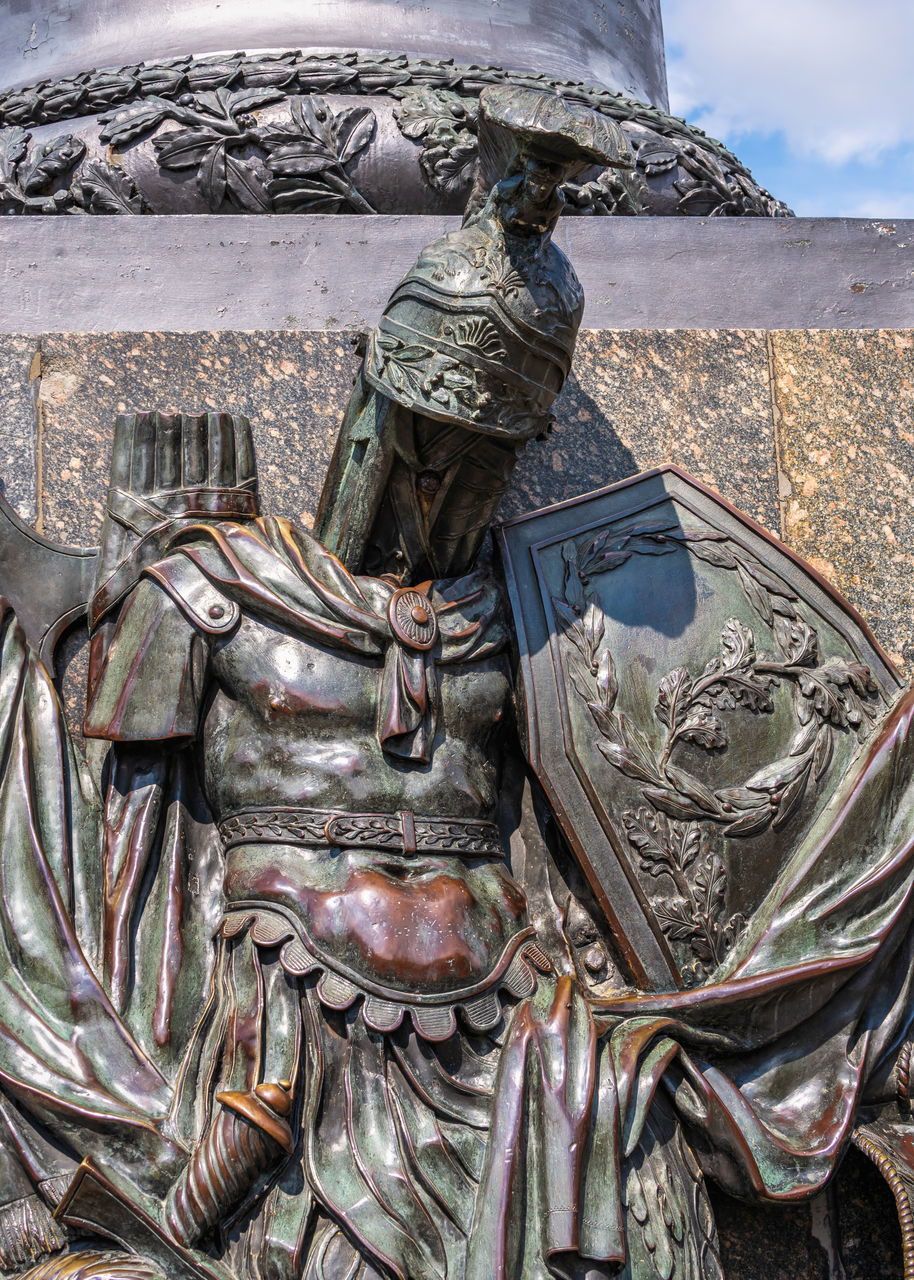 CLOSE-UP OF STATUE OF METAL