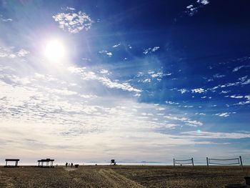 People on beach against sky