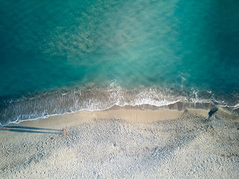 High angle view of surf on beach