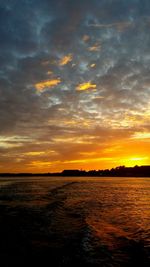 Scenic view of sea at sunset