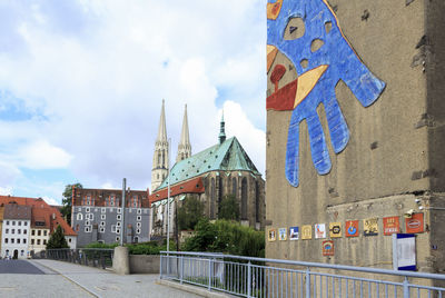 View of buildings in city against sky