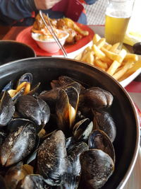 Close-up of mussels and chips traditional belgian food