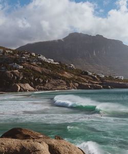 Scenic view of sea against cloudy sky