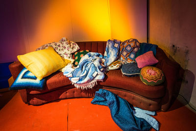 High angle view of messy sofa at home