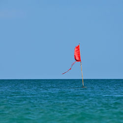 View of sea against clear blue sky