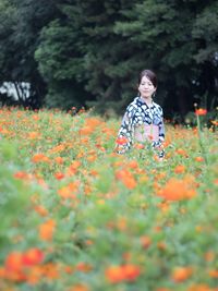 Full length of woman standing on field