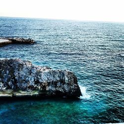 Scenic view of sea against blue sky