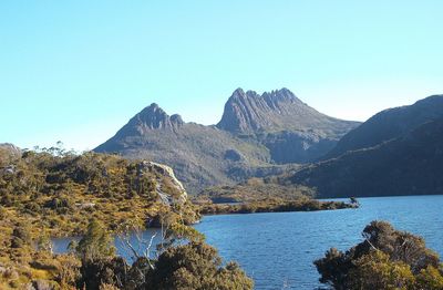 Scenic view of lake with mountain range in background