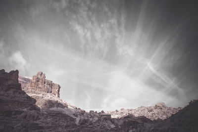 Low angle view of rocks against sky