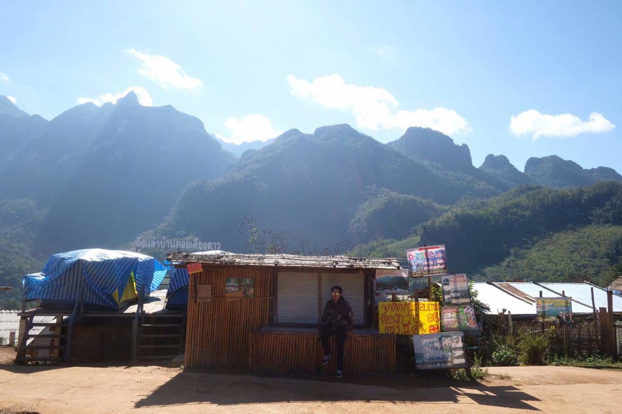 MAN AND WOMAN AGAINST MOUNTAIN RANGE