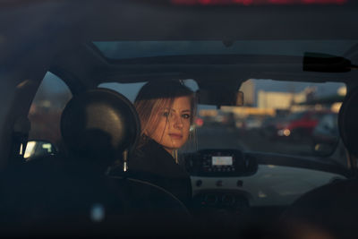 Silhouette woman in car